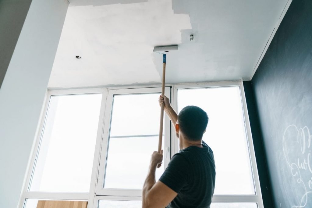 Man painting a ceiling