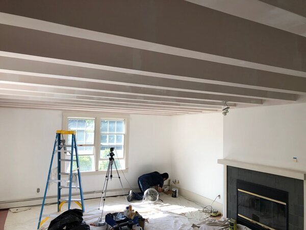 Man painting a house interior