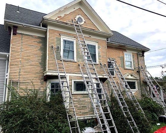 Painting a tall homes exterior