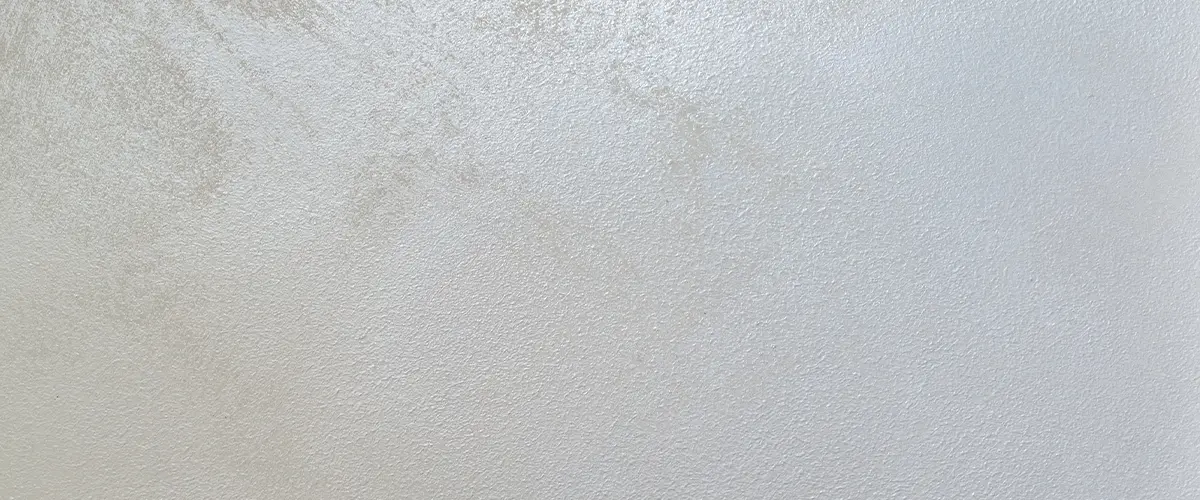 Subtle neutral wall texture showcasing soft paint application, ideal for minimalist interior design.