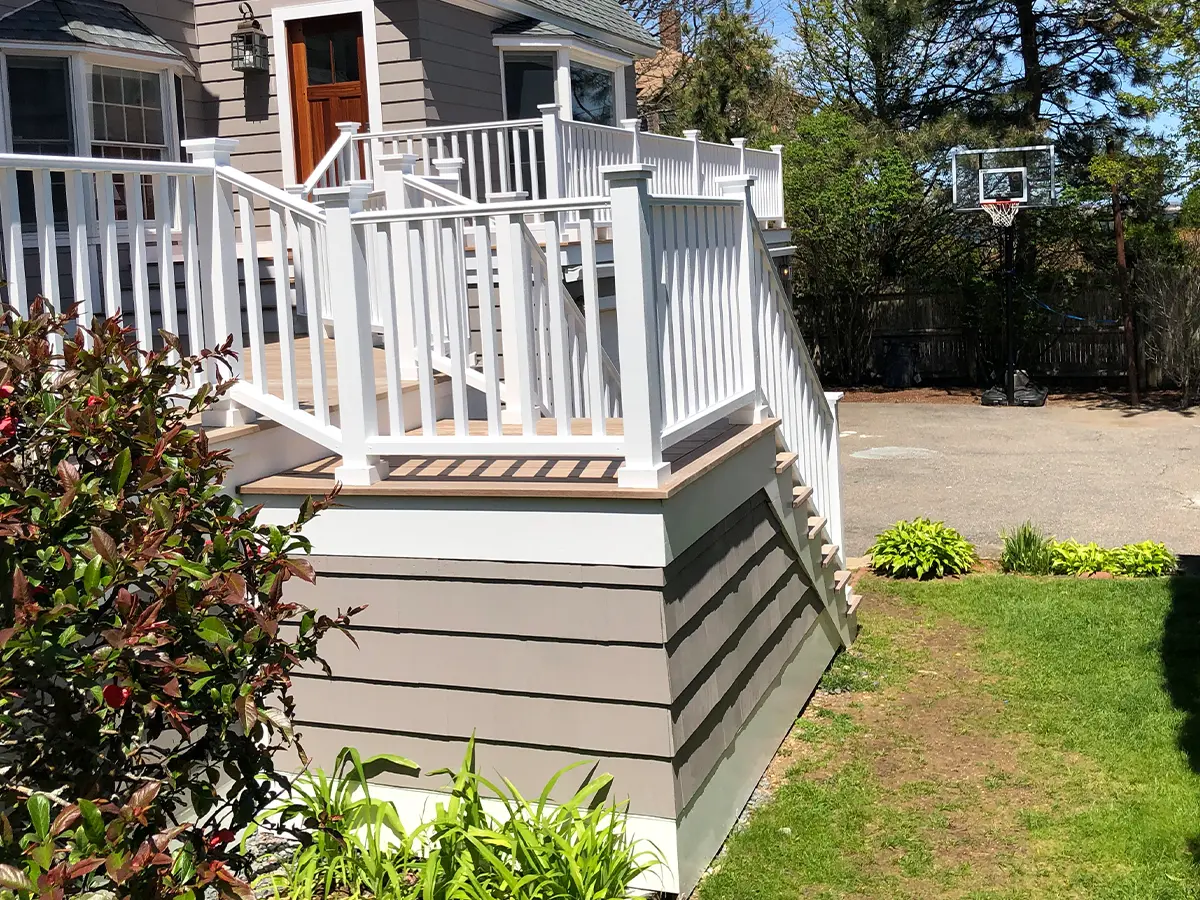 Backyard deck with white railings, providing a clean, modern outdoor space for relaxation.