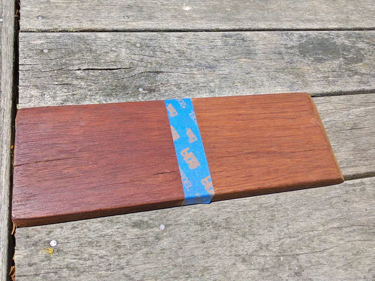 Wooden deck stain sample on weathered wood, illustrating contrast before and after deck staining.